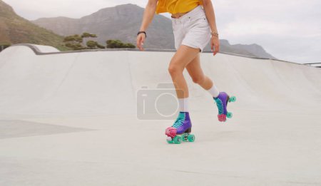 Photo for Fitness, health and roller skates with shoes of woman in park for training, hobby and freedom. Summer break, sports and speed with feet of girl skating for exercise, workout and movement in outdoors. - Royalty Free Image