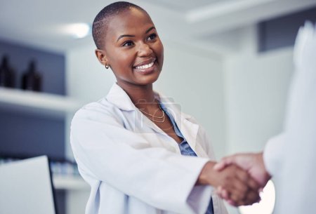 Black woman, scientist and handshake, smile for partnership and science collaboration with introduction in lab. Congratulations, thanks or onboarding with hiring, doctor team shaking hands and trust.