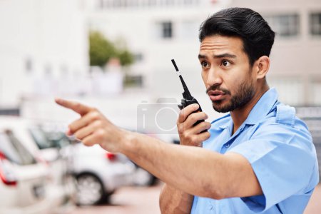 Photo for Security man, radio and point in street for inspection, law or warning with call, backup and city. Police officer, outdoor and communication to stop crime on walkie talkie, public services or safety. - Royalty Free Image