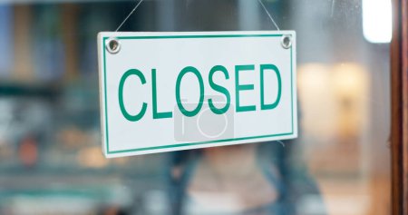 Photo for Front door, small business or closed sign on window in coffee shop or restaurant for end of service. Closing time, diner or glass with board, poster or message in retail store or cafe for notice. - Royalty Free Image