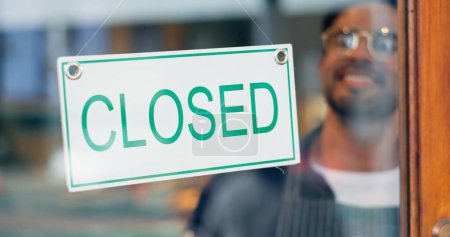 Photo for Happy man, small business or closed sign on window in coffee shop or restaurant for end of service. Closing time, smile or manager with board, poster or message in retail store or cafe for notice. - Royalty Free Image