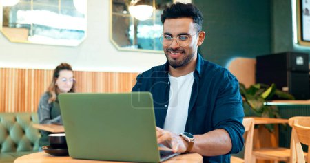 Photo for Coffee shop, internet and man with a laptop, typing and connection with website, startup and planning. Person, freelancer and entrepreneur with a pc, cafe or project with copywriting or digital app. - Royalty Free Image