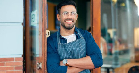 Photo for Waiter, man and portrait with arms crossed or happy for service, welcome or server in coffee shop. Barista, person and face with smile for hospitality, career or confidence at entrance of restaurant. - Royalty Free Image