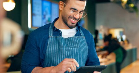 Photo for Cafe, happy man and barista on tablet of restaurant sales, online management or customer service reviews. Entrepreneur, waiter or small business owner reading digital technology for coffee shop data. - Royalty Free Image