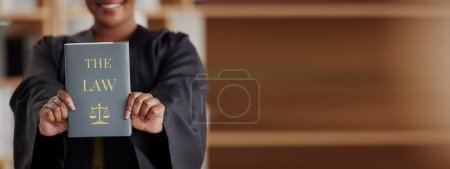 Photo for Hands, banner or judge with book, constitution research or education for learning the justice system. Lawyer, advocate or closeup of attorney studying legal knowledge or court info with mockup space. - Royalty Free Image