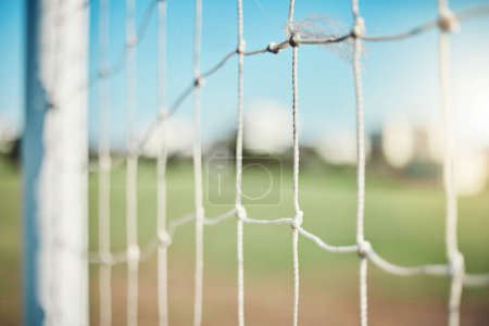Photo for Empty, sports and goal post on soccer field for fitness training, exercise or workout outdoors. Football club, grass pitch background or closeup of blur net of game in competition or match contest. - Royalty Free Image