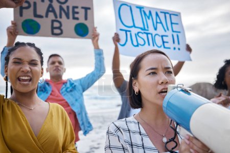 Photo for Megaphone, climate change and Asian woman protest with crowd at beach protesting for environment and global warming. Save the earth, group activism and people shouting on bullhorn to stop pollution - Royalty Free Image