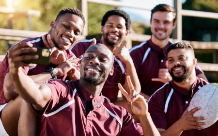 Photo for Selfie, rugby team and men with phone smile ready for exercise, sports training and workout on field. Fitness, teamwork and athletes take picture on smartphone for post before match, game or practice. - Royalty Free Image