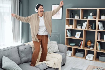 Photo for Headphones, senior or happy woman dancing to music or streaming to relax with freedom at home. Retirement, smile or excited mature person listening to a radio song or audio on an online subscription. - Royalty Free Image