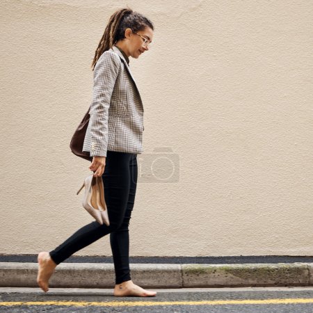 Photo for Tired, depression and business woman in city for thinking, fatigue and fear. Burnout, mental health and mistake with female employee walking in street for sad, failure and crisis with wall mockup. - Royalty Free Image