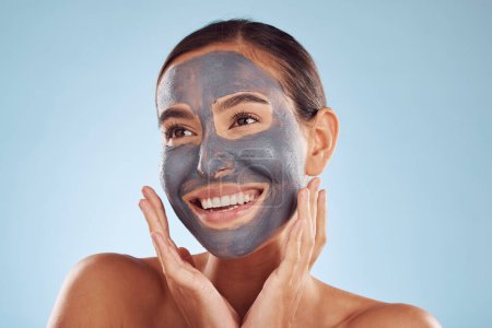 Photo for Woman thinking, mask and facial charcoal for skincare, natural beauty and cosmetics benefits on studio, blue background. Ideas of happy person or model with face collagen, skin care and dermatology. - Royalty Free Image