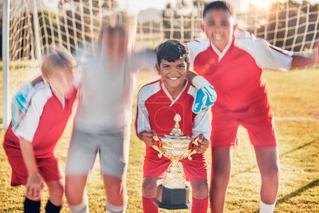 Photo for Trophy, soccer and team in celebration of success as winners of a sports award in a childrens youth tournament. Happy, goals and young soccer players celebrate winning a kids football championship. - Royalty Free Image