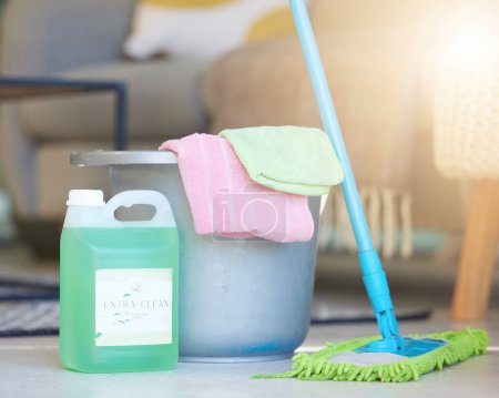 Photo for Cleaning, soap detergent product and bucket with mop for domestic work, household chores and sanitizing house to get rid of germs, bacteria and dirt. Clean living room, shiny floor and spotless house. - Royalty Free Image