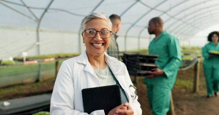 Photo for Portrait, botanist and happy woman at greenhouse with tablet tech for science at farm, plant and ecology. Face, smile and mature scientist at nursery for agriculture in glasses for research in Mexico. - Royalty Free Image