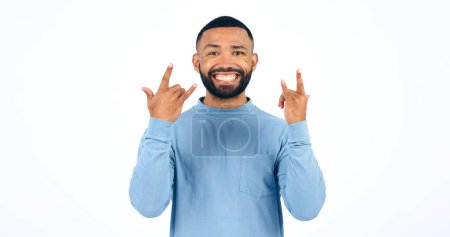 Photo for Happy man, rocker and hands with smile in studio with portrait for mockup on white background. Male model, face and excited in freedom, fun or party for energy of music, sign or punk gesture in space. - Royalty Free Image