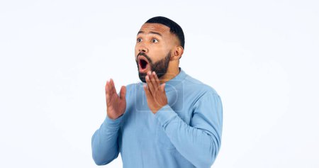 Photo for News, announcement and man with surprise on face in studio, white background or mockup space. Wow, emoji and excited or shocked person with secret, drama or hearing crazy information on promotion. - Royalty Free Image
