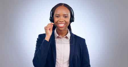 Photo for Call center, woman and portrait in studio for customer service, CRM questions or IT support on grey background. Face, happy telemarketing agent or african consultant with microphone for communication. - Royalty Free Image