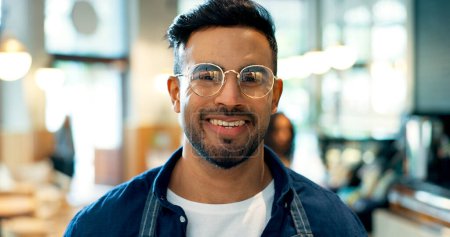 Photo for Portrait, happy man or business owner with smile in coffee shop for startup, career or service in hospitality. Mexican person, face and glasses with excitement for vision of cafe, restaurant or store. - Royalty Free Image