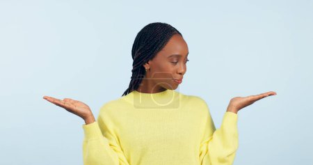 Photo for Black woman, palm and advertising in choice, decision or marketing against a studio background. African female person with hands out for selection, information or showing services on mockup space. - Royalty Free Image