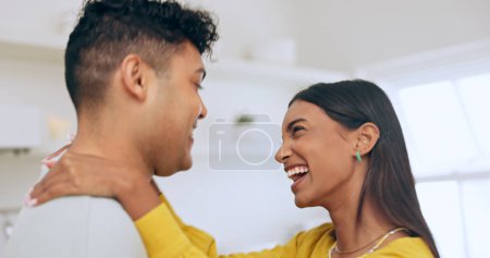 Photo for Happy, couple is dancing in kitchen and hug for love with affection, bonding and romantic date at home. Fun, interracial people and commitment, loyalty and respect in healthy relationship with laugh. - Royalty Free Image