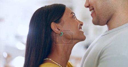 Photo for Happy, couple and profile, hug and love with affection, bonding and romantic date at home. Dancing, interracial and people with commitment, loyalty and respect in healthy relationship with smile. - Royalty Free Image