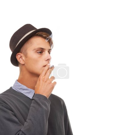 Photo for Young man, hat and smoking cigarette in stylish fashion isolated against a white studio background. Cool male person, model or smoker chilling in vintage clothing or having a casual smoke on mockup. - Royalty Free Image