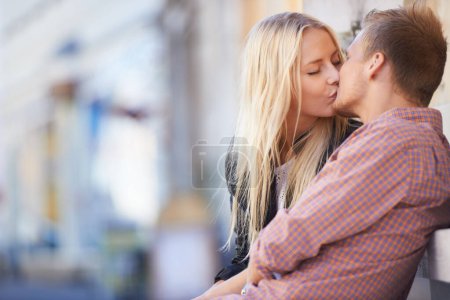Photo for Couple, love or kiss in city with romance, relax or weekend date for bond in quality time together. Happy man, woman or intimate connection in relationship, marriage or care on honeymoon in england. - Royalty Free Image