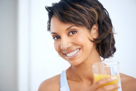 Photo for Orange juice, glass and happy woman portrait with health breakfast, nutrition and vitamin c benefits for energy. Brazil nutritionist, wellness and glow face with fruit drink, detox and antioxidant. - Royalty Free Image