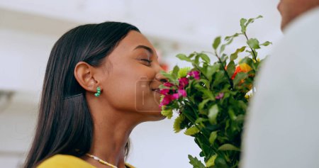 Photo for Home, gift and woman smell flowers with a smile on valentines day, anniversary or surprise from partner. Happy, wife or girlfriend with flower bouquet, present and enjoying floral scent in house. - Royalty Free Image