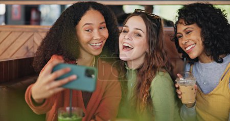 Photo for Girl friends, selfie and group in coffee shop for peace sign, care or kiss with smile, love or post for web blog. Women students, photography and profile picture in cafe for reunion with happy memory. - Royalty Free Image
