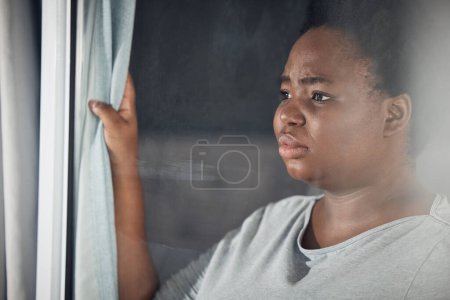 Photo for Curtain, thinking or black woman with depression, stress or mental health problem by window at home. Worry, lonely or tired African person with broken heart, loss or anxiety from emotional grief. - Royalty Free Image