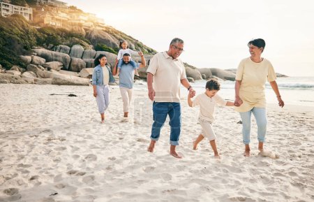 Photo for Holding hands, big family and walking at a beach for travel, vacation and fun in nature together. Freedom, parents and children relax with grandparents at the sea on holiday, trip or ocean adventure. - Royalty Free Image