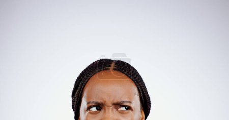Photo for Thinking, face and eyes of confused black woman with doubt, questions or remember idea in white background. Mockup, space and person frustrated with a memory, choice or planning a decision in studio. - Royalty Free Image