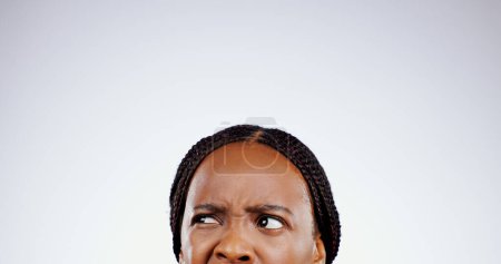 Photo for Confused, face and eyes of black woman thinking with doubt, questions or remember idea in white background. Mockup, space and person frustrated with a memory, choice or planning a decision in studio. - Royalty Free Image