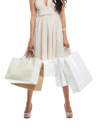 Photo for Hands, legs and woman with shopping bags for fashion in dress isolated on a white background. Body of customer with gift in boutique, sales discount and retail market clothes or deal in luxury mall. - Royalty Free Image