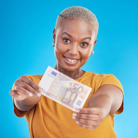 Photo for Black woman, euro note and finance, portrait and happy with prize, loan and cash isolated on blue background. Money, cashback and lottery win with payment, financial freedom and invest in a studio. - Royalty Free Image