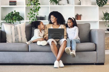 Photo for Mother, children and laptop in family home living room for remote work, online education and wifi. Woman and girl kids together on couch with internet for learning, games and watch movies or relax. - Royalty Free Image