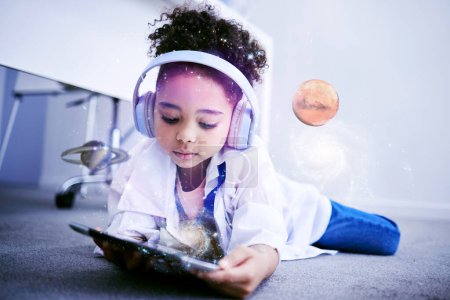 Photo for Child, science and astronomy on tablet with web education and internet app for kids. Home, child and digital holograph of space and planets with headphones listening to children research podcast. - Royalty Free Image