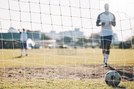 Photo for Sports, soccer and ball in net after goal, score and winning on field for training, practice and game match. Motivation, football club mockup and players outdoors for fitness, exercise and workout. - Royalty Free Image