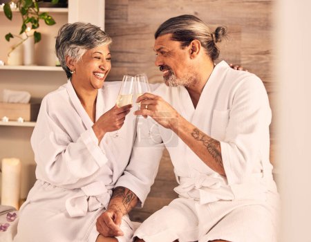 Photo for Couple, hotel and wine glasses for toast in massage, vacation or holiday celebration, love and romance. Champagne, excited and senior people for luxury, wellness and relax, hospitality service or spa. - Royalty Free Image