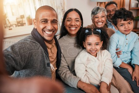 Photo for Selfie, generations and smile in portrait on couch, bonding with love and care at family home. Happy people in living room, grandparents and parents with children smile in picture with memory. - Royalty Free Image