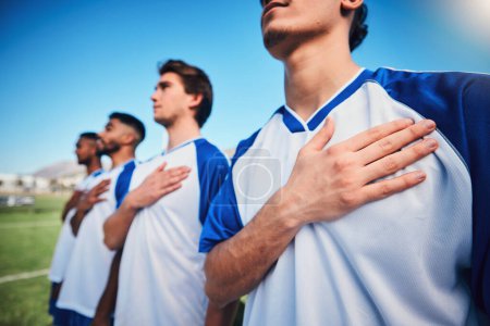 Photo for Football team, national anthem and listening at stadium before competition, game or match. Soccer, song and sports players together for pride, collaboration for contest or exercise with hands closeup. - Royalty Free Image