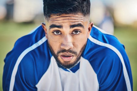 Photo for Soccer player, tired or portrait of man in sports training, game or match breathing heavy on a field pitch. Face, fatigue or exhausted male athlete in football workout or fitness exercise on break. - Royalty Free Image