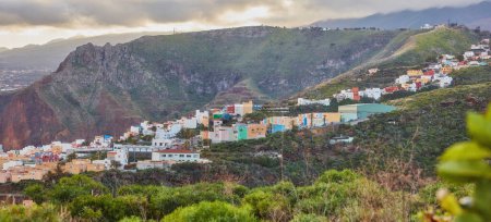 Photo for Colorful buildings in Santa Cruz, La Palma, Canary Islands with copy space. Beautiful cityscape with bright colors and mountains. A vibrant holiday, vacation and getaway destination on the hillside. - Royalty Free Image