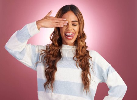 Photo for Hand, woman and tongue out in studio, crazy and having fun against red background. Face, emoji and gen z girl model posing, young and confident, playful and goofy, casual and comic while isolated. - Royalty Free Image