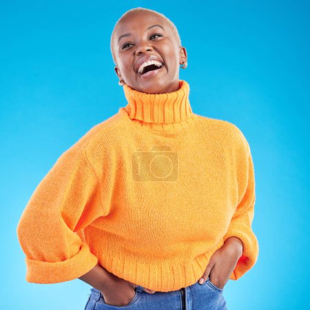 Photo for Blue background, studio and happy African woman with fashion, natural beauty and confidence in casual style or clothes. Portrait, smile and person with happiness in winter clothing or college student. - Royalty Free Image