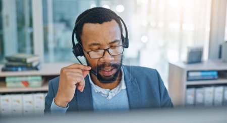 Photo for Computer, call center and support with a black man consultant working in customer service for assistance. Contact, crm and headset communication with an employee consulting in an office for sales. - Royalty Free Image