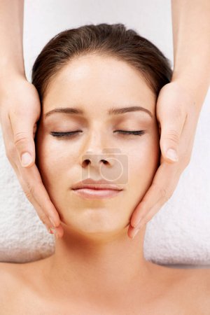 Photo for Spa, massage and hands on face of woman from above at a resort for stress relief, pamper or treatment. Top view, facial and female with masseuse at a beauty salon for luxury, skincare or dermatology. - Royalty Free Image
