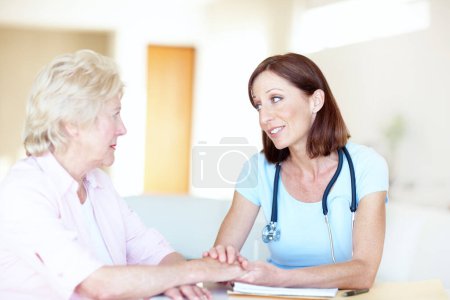 Photo for Seeking comfort and advice from her trusted doctor - Senior Health. Mature doctor reassures her senior female patient with kind words - Royalty Free Image