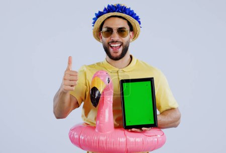 Photo for Green screen, tablet and happy man with thumbs up in studio for travel, review or service feedback on grey background. Digital, space or male traveler smile with emoji vote for app, offer or approval. - Royalty Free Image